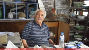 Mr. Ioannis Evgenikos in the museum of the Friends of Enamel Factory Association, which he maintains in Kea © Marcos Andreou